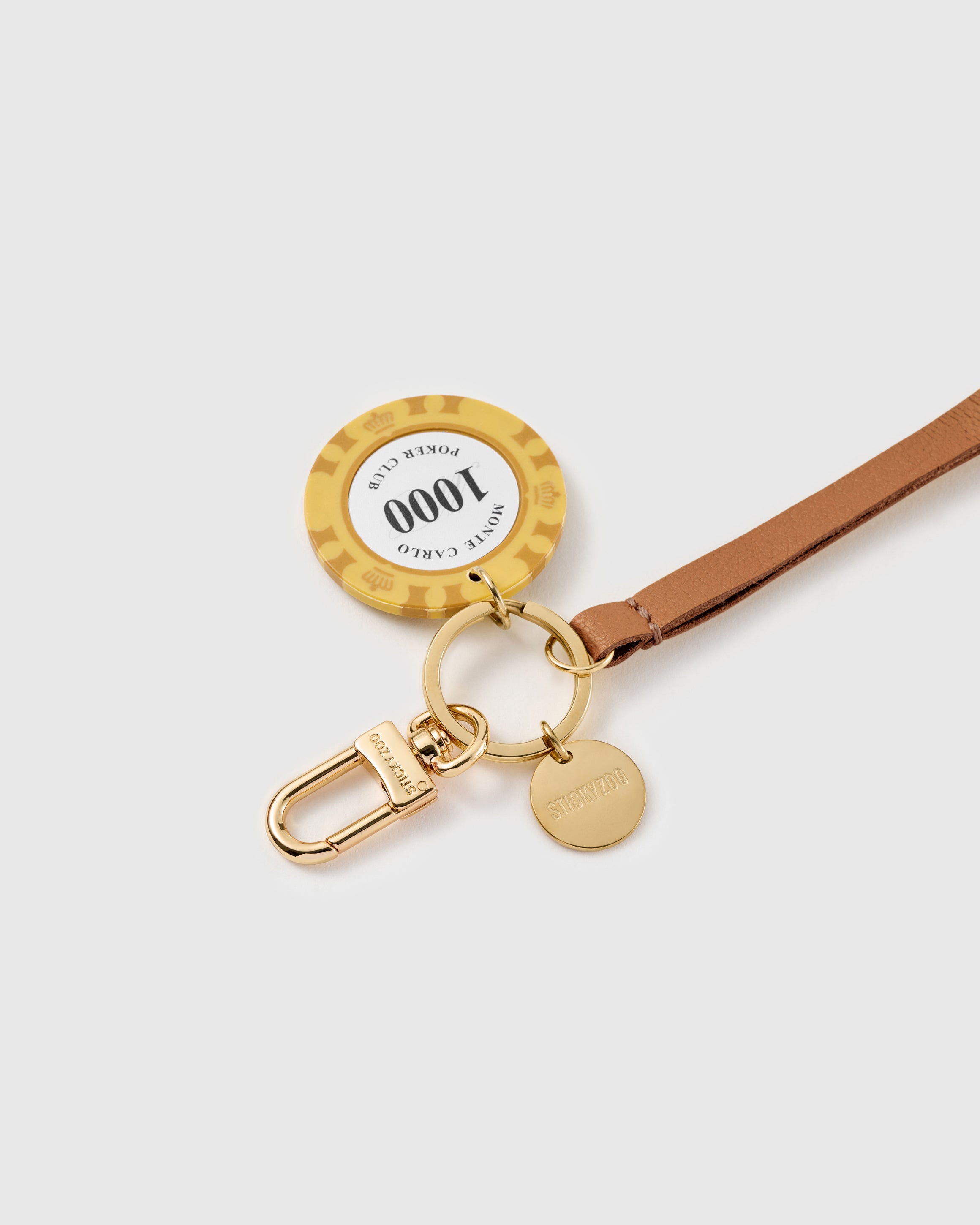 Close-up of the yellow casino chip charm and hand-cut French Alran goatskin, loved by thousands of STICKYZOO customers