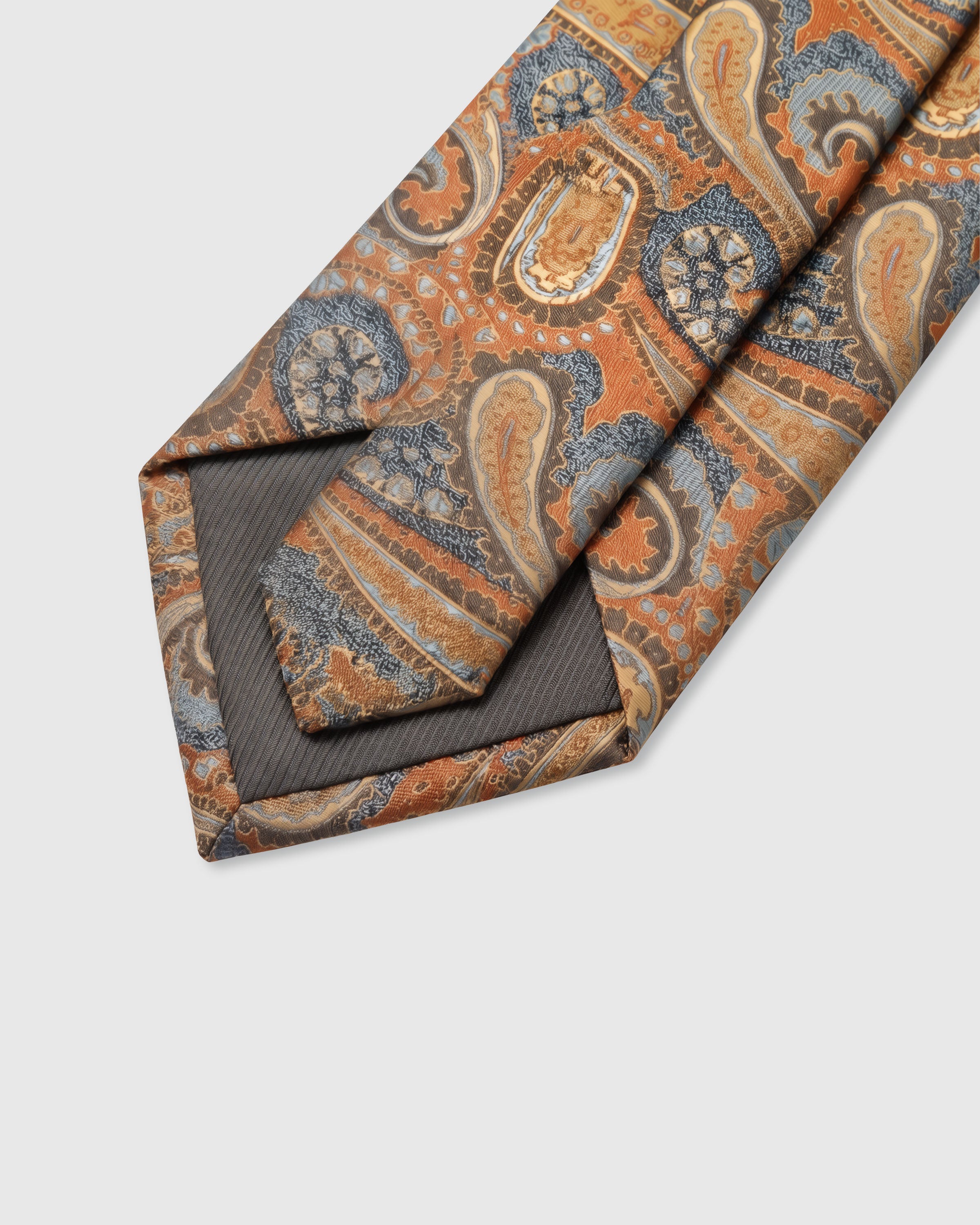 {Hand-finished interior} STICKYZOO COPPER PAISLEY TIE back detail showing structured interlining and hand-finished slip stitching, 145 x 8 cm