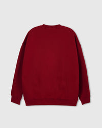 Close-up of ribbed cuff and hem on STICKYZOO red Teddy Bear Sweatshirt showing premium construction