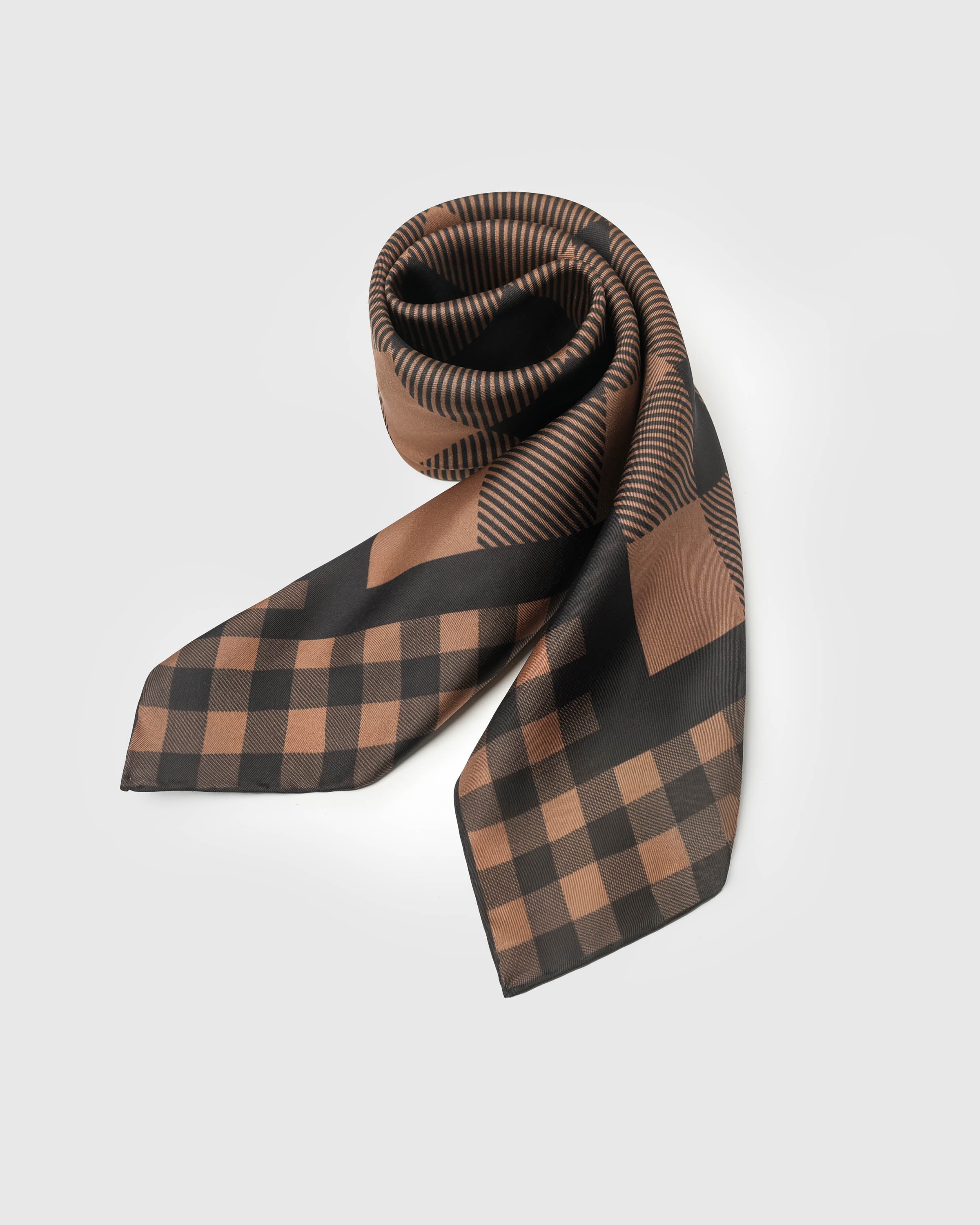 Rolled cognac gingham scarf showing the silk hand and the way the two-scale check meets across the fold
```
