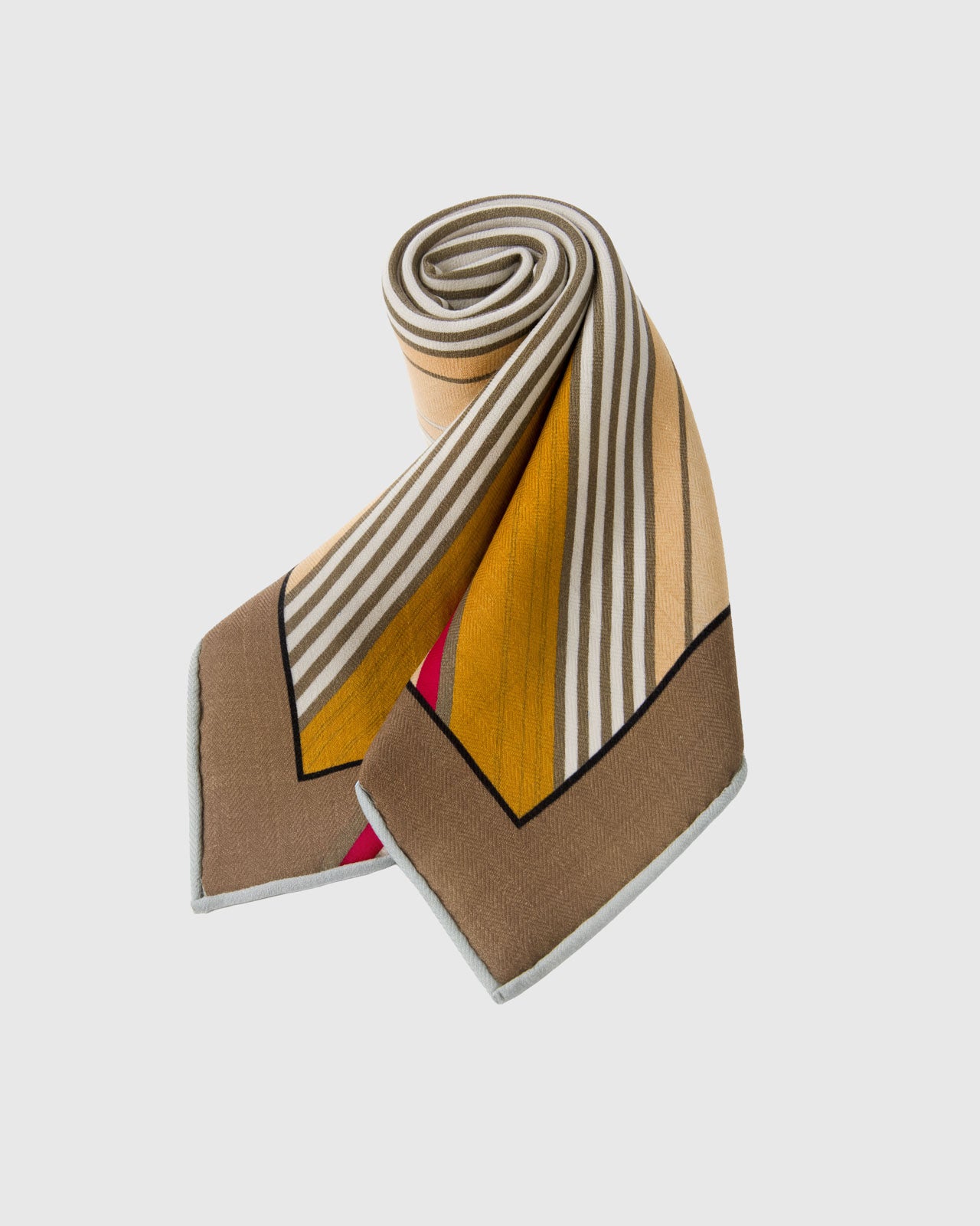 Silk scarf rolled to show the mustard and sand stripe bands and the soft taupe border catching the light
```