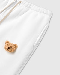 Detail view of plush bear face applique on STICKYZOO Sticky Bear Sweatpant showing dimensional depth