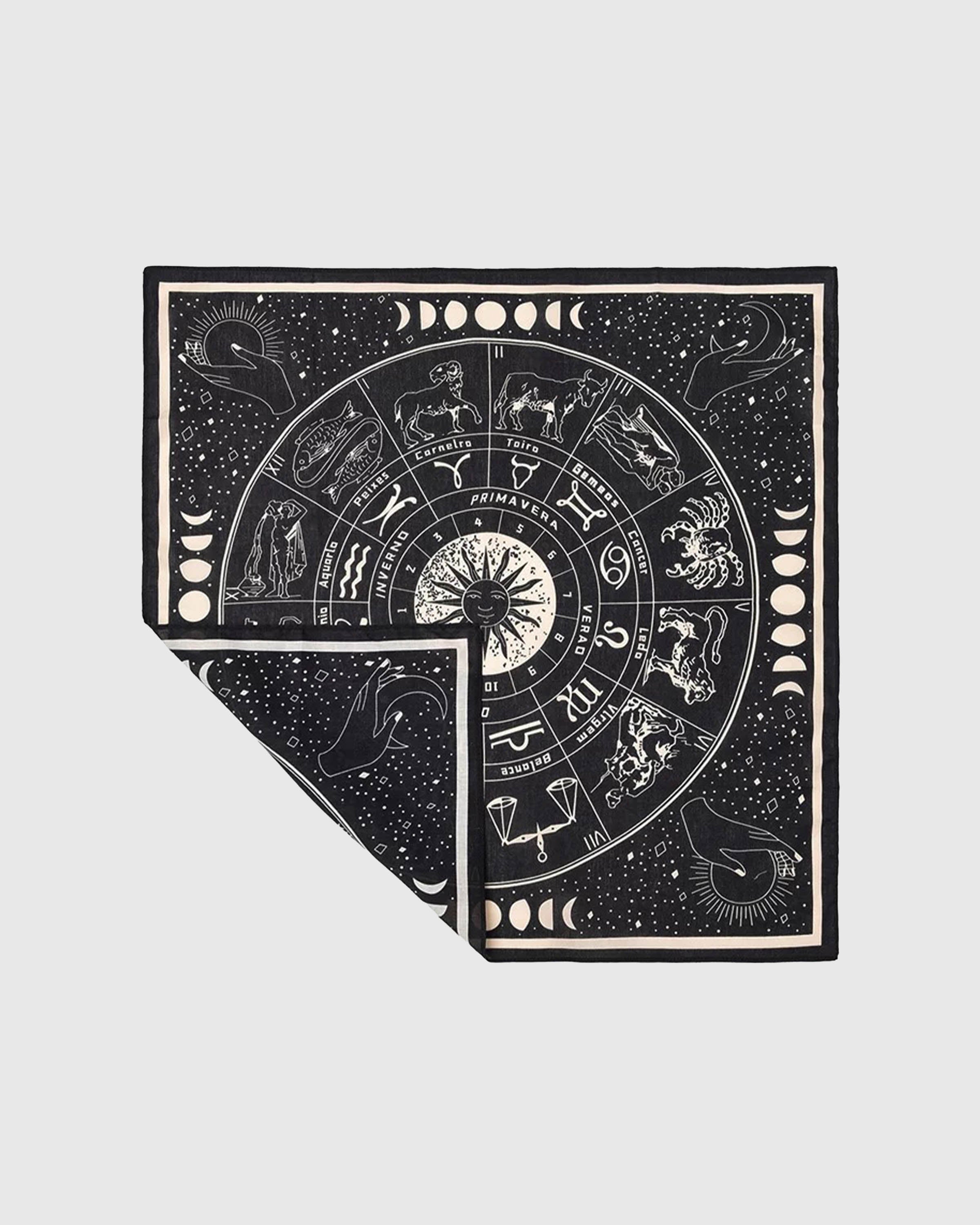 Zodiac silk scarf folded back to show the moon-phase border and the soft silk reverse fade