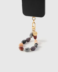 Close-up of mixed earth-tone marble stone beads showing amber onyx and peach veining with gold STICKYZOO clasp