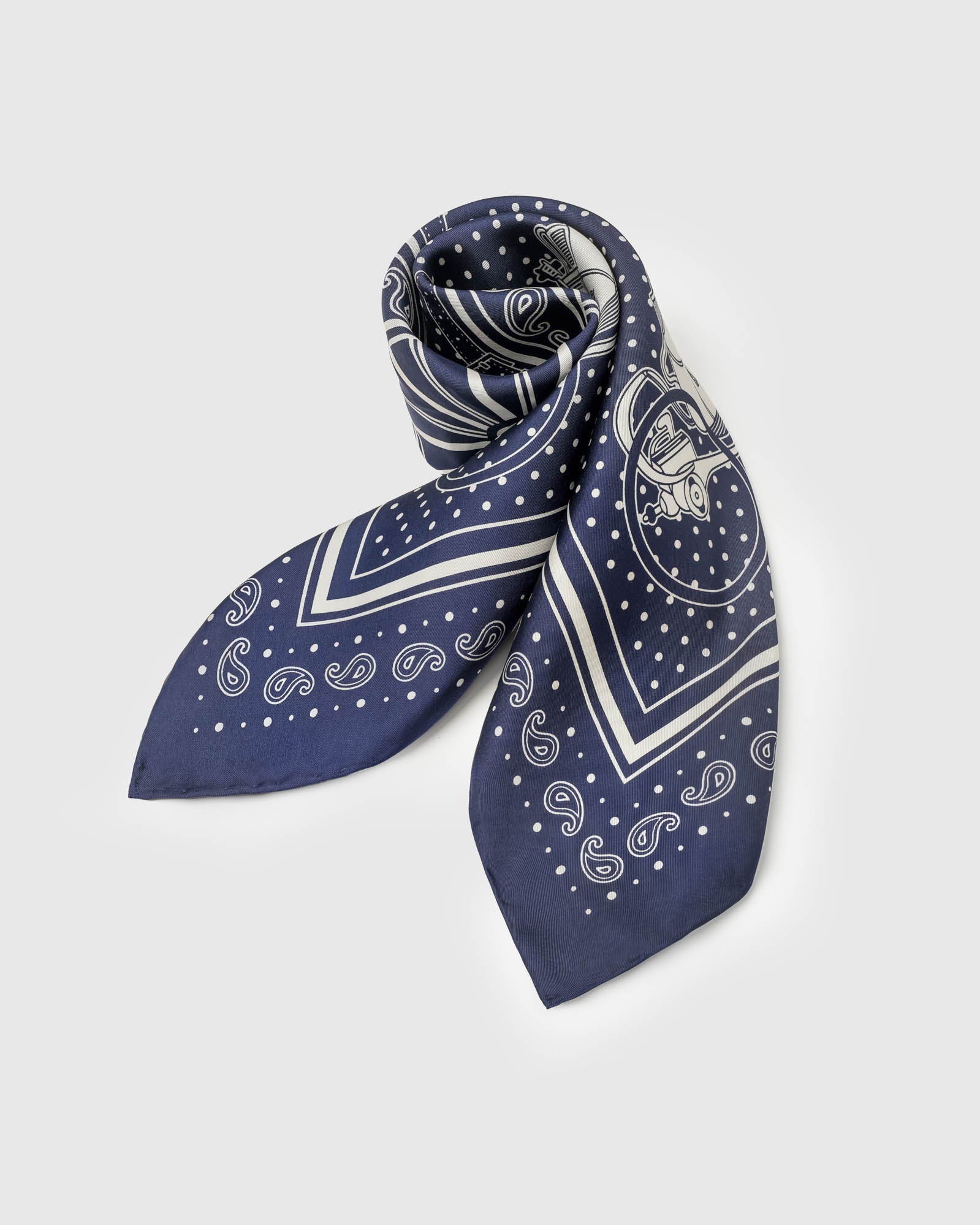 Navy bandana silk scarf with ivory paisley, horse-drawn carriages, and a central wheel medallion
```