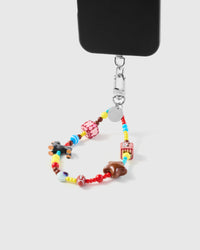 Carnival mix phone strap hanging from black phone case showing wrist carry functionality