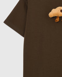 Detail of sleeve and side on STICKYZOO brown Runaway Croissant T-Shirt showing boxy construction