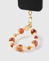 Amber marble phone strap hanging from black case showing mixed stone bead detail