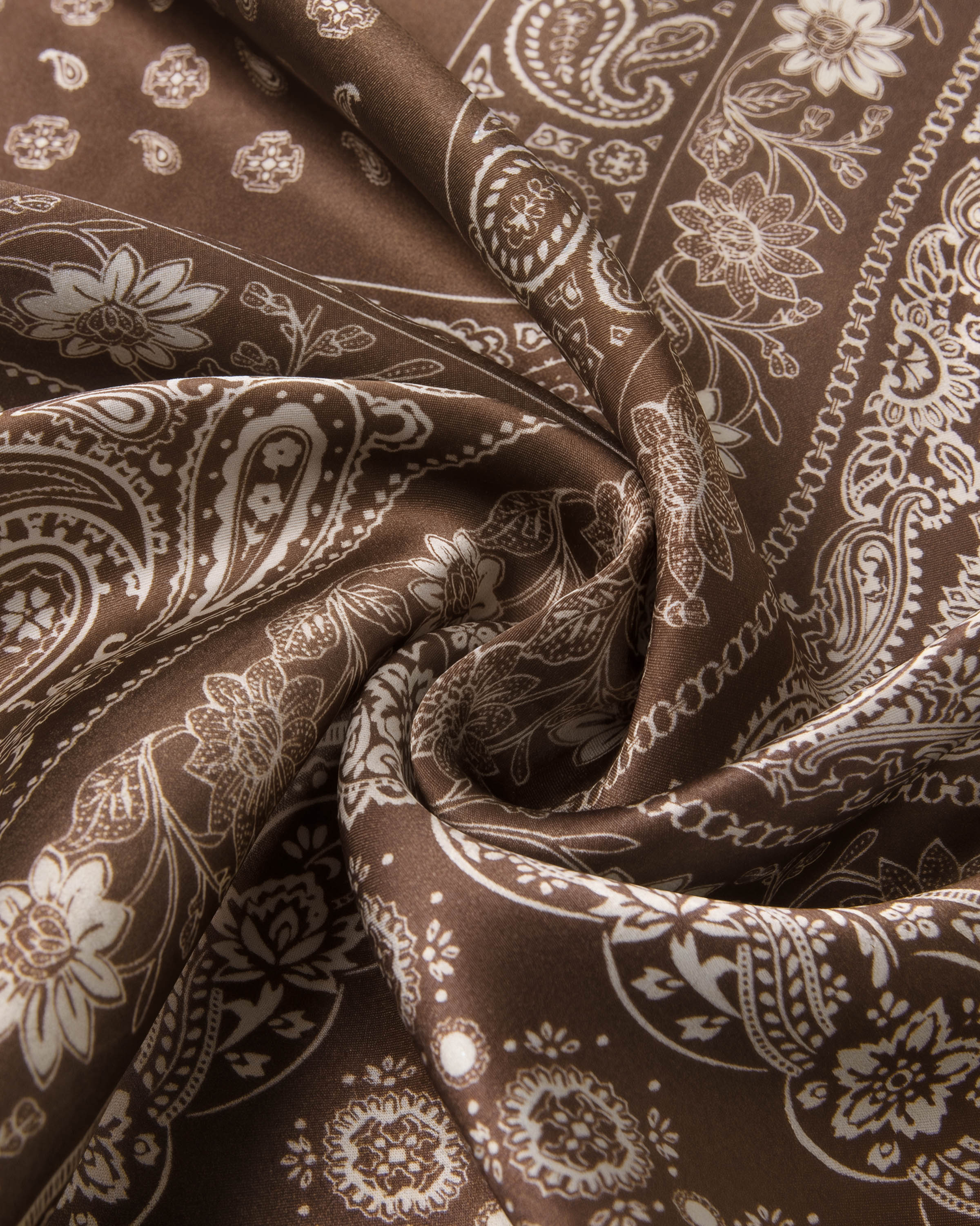 STICKYZOO cocoa silk scarf draped to show the patchwork paisley print and the soft silk hand
```