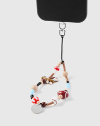 Sporty dog phone strap attached to phone case showing wrist carry functionality