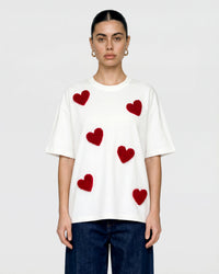Back view of STICKYZOO Scattered Heart T-Shirt in white showing dropped shoulders and relaxed proportions