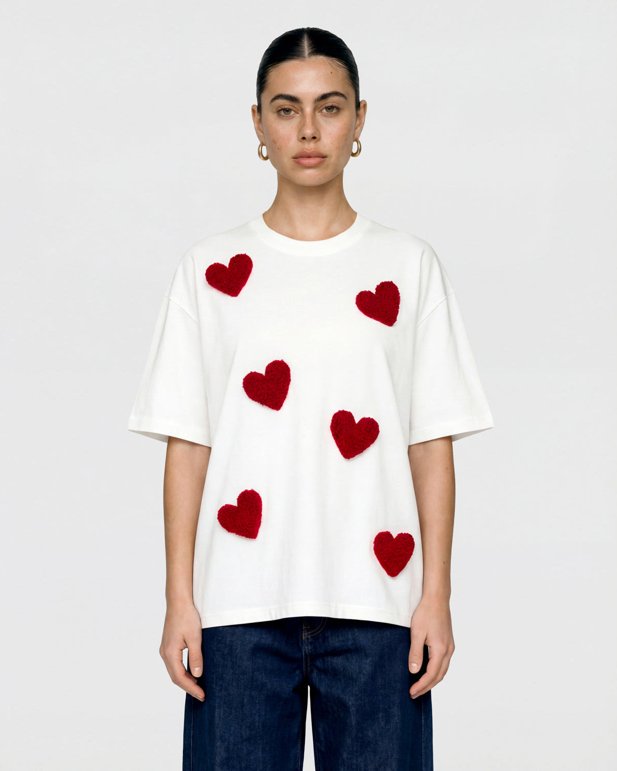 {{Each heart handmade}} Back view of STICKYZOO Scattered Heart T-Shirt in white showing dropped shoulders and relaxed proportions