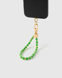 STICKYZOO Jade Speckle Orbit phone strap attached to black phone case showing round green stone beads