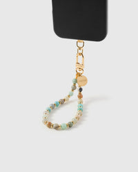 Mint green amazonite phone strap hanging from black phone case showing wrist carry