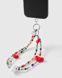 Triple heart multi-strand strap hanging from black phone case showing colorful beadwork