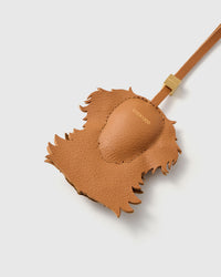 smooth French Alran goatskin with gold debossed STICKYZOO mark and hand-stitched edges. 18K gold-plated hardware.
