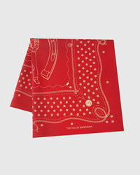 STICKYZOO crimson horseshoe silk scarf folded flat showing the cowboy-and-horseshoe motif