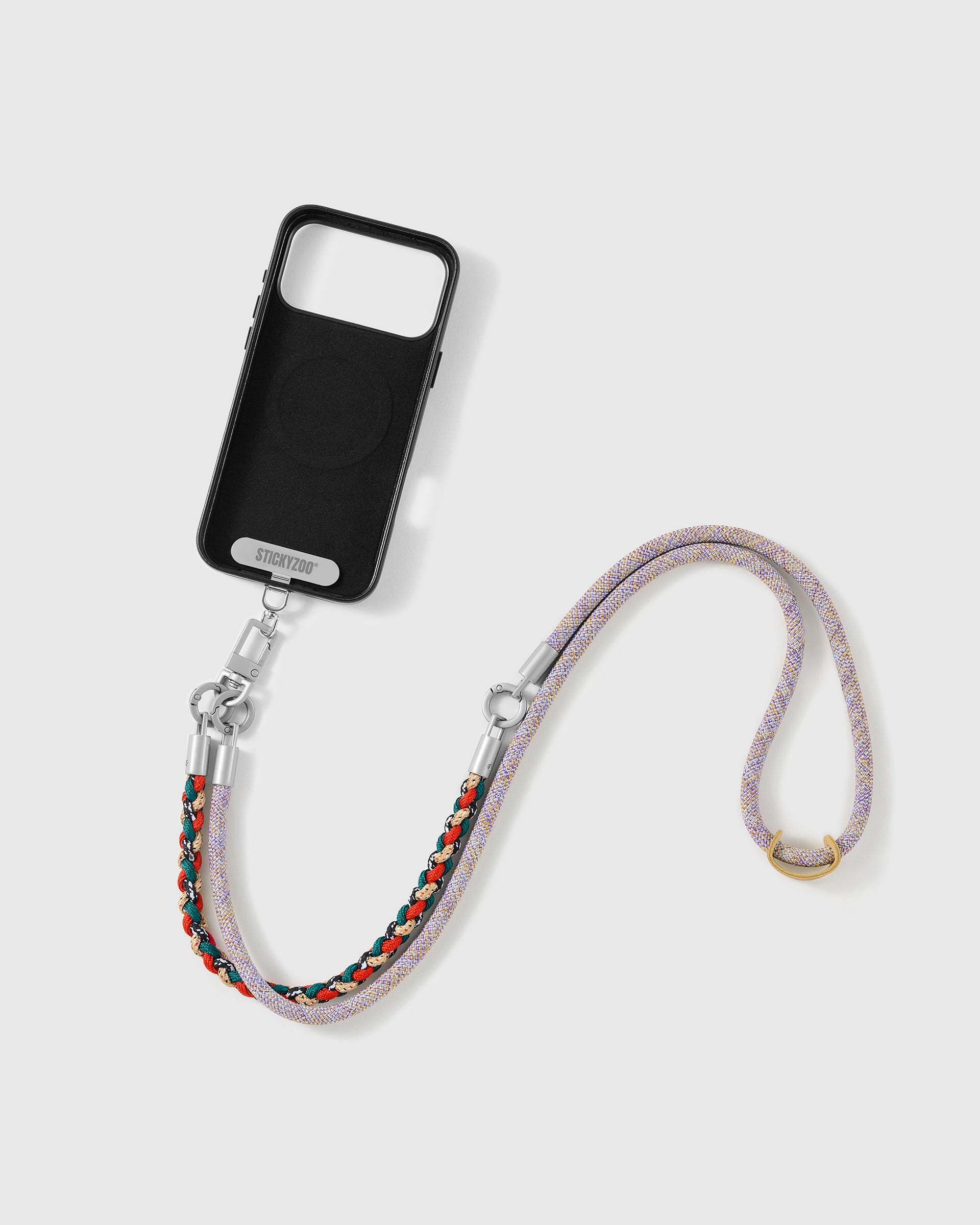 Phone worn cross-body on the heather braided strap, hands-free for everyday carry
