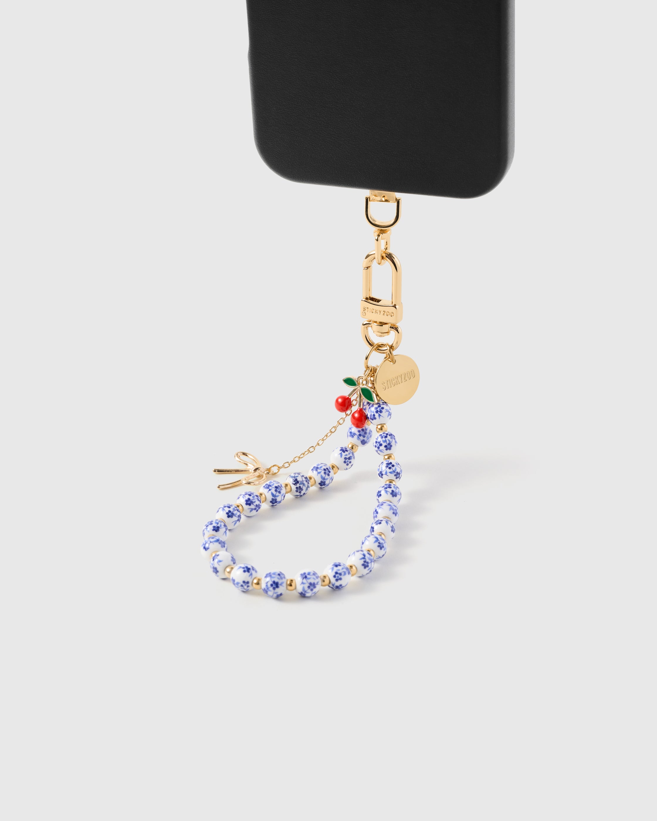iPhoneアクセサリー winsome._4 Porcelain Cherry Phone Strap — Handmade Floral Bead Wristlet