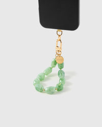 STICKYZOO Jade Marble phone strap attached to black phone case showing translucent green stone beads