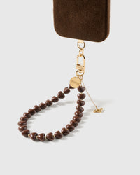 cocoa dachshund heart phone strap clipped to a black phone case — hands-free wrist carry. Rated 4.9 stars.
