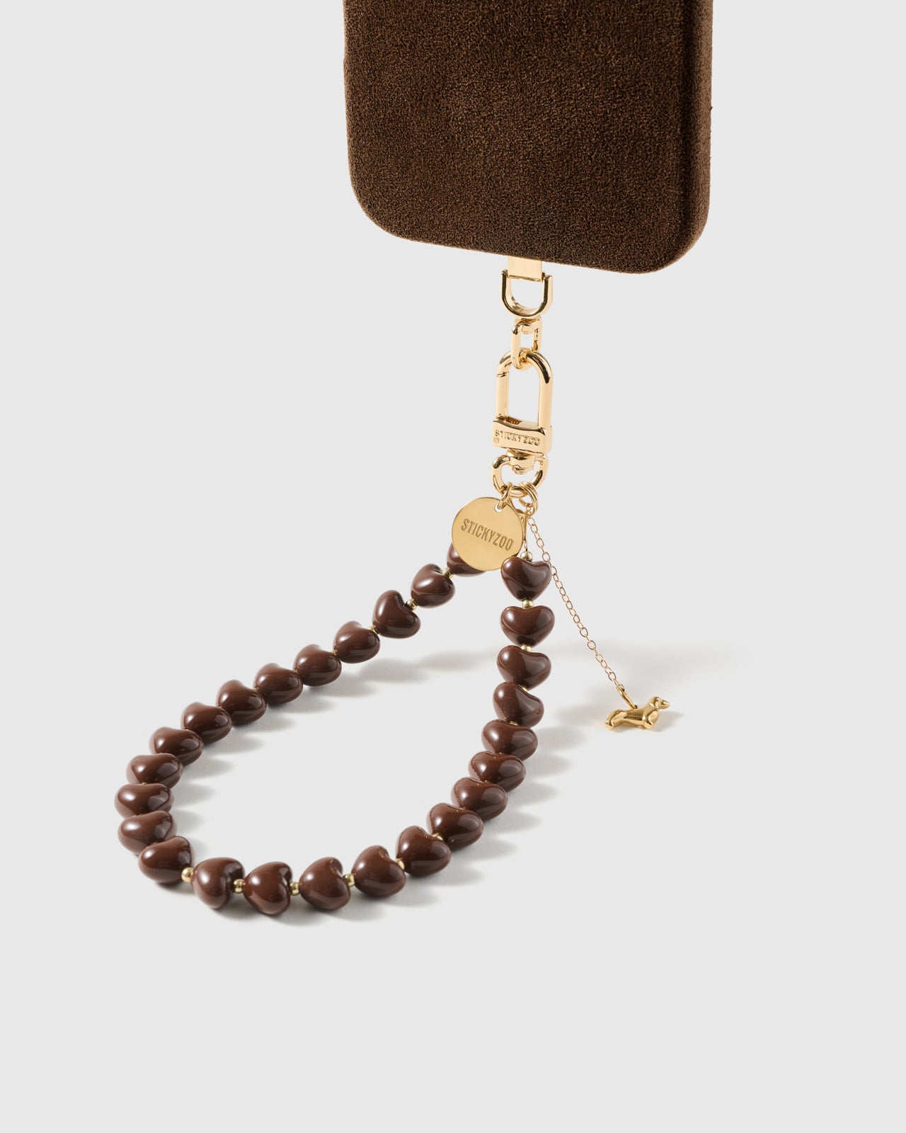 cocoa dachshund heart phone strap clipped to a black phone case — hands-free wrist carry. Rated 4.9 stars.