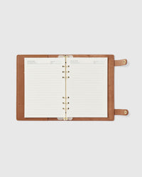 18K gold-plated ring mechanism detail on STICKYZOO camel genuine goatskin leather notebook, smooth and secure page alignment