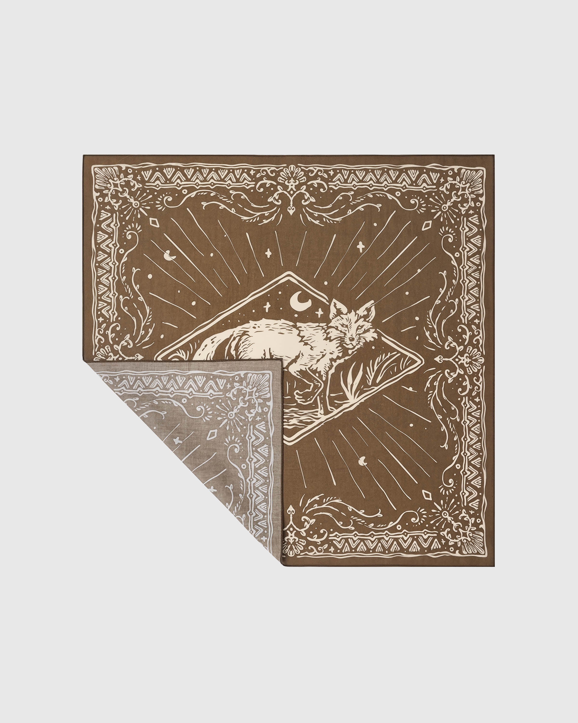 Folded moonlit fox silk scarf showing the ivory print on olive ground and the soft silk reverse fade