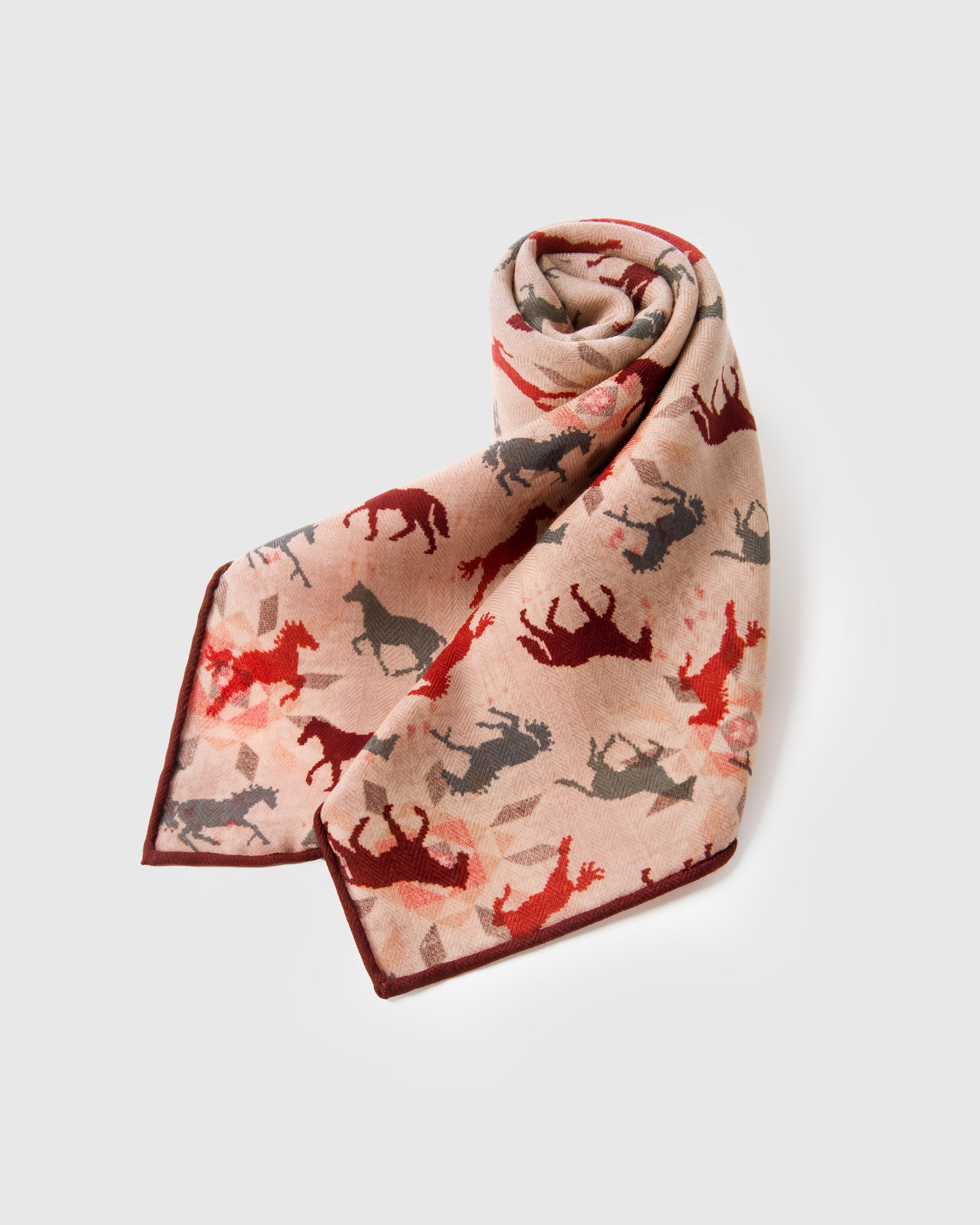 Folded silk horse-print scarf showing the burgundy border framing the equestrian motif
```