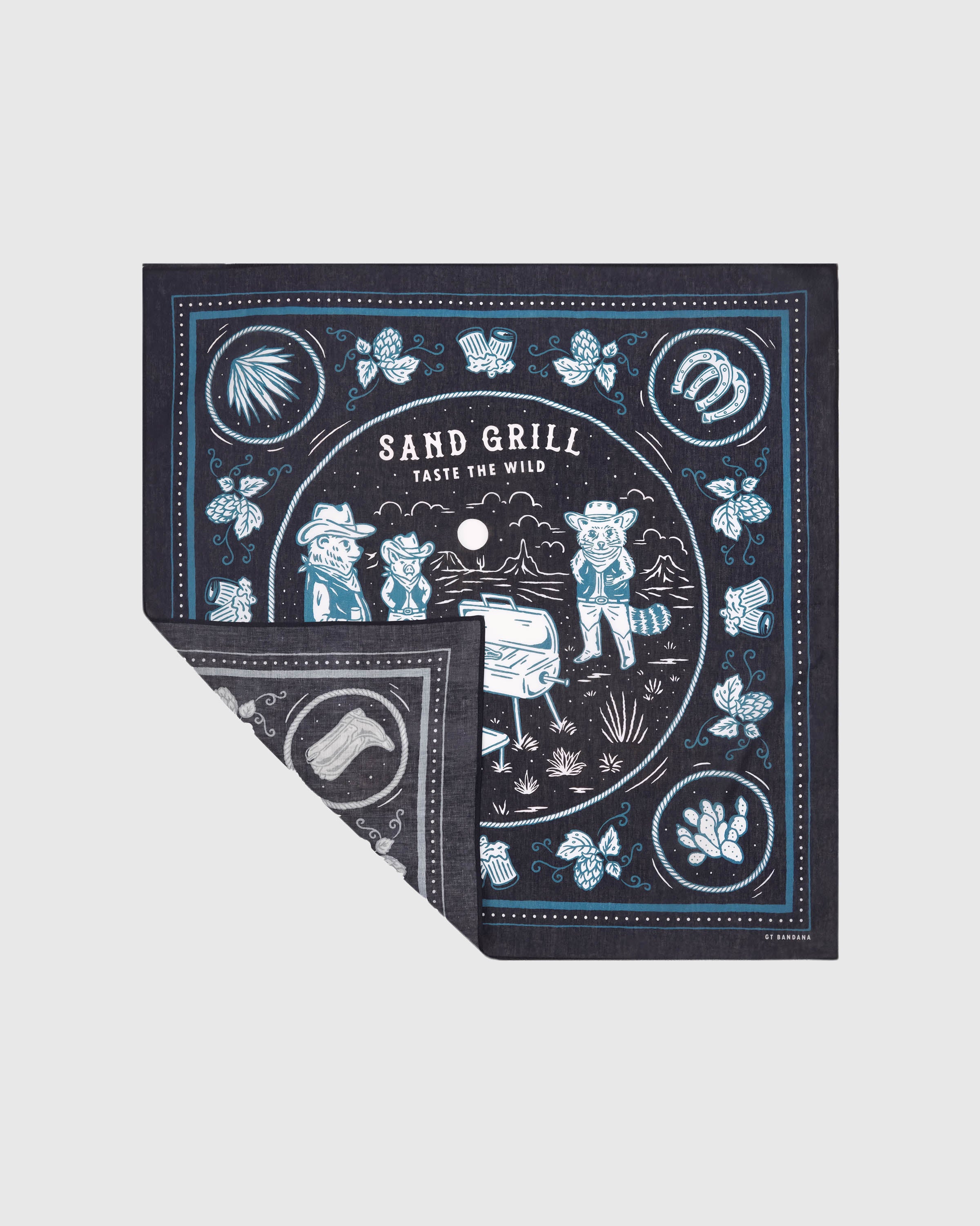 Folded campfire critters silk scarf showing the printed central scene and the soft silk reverse