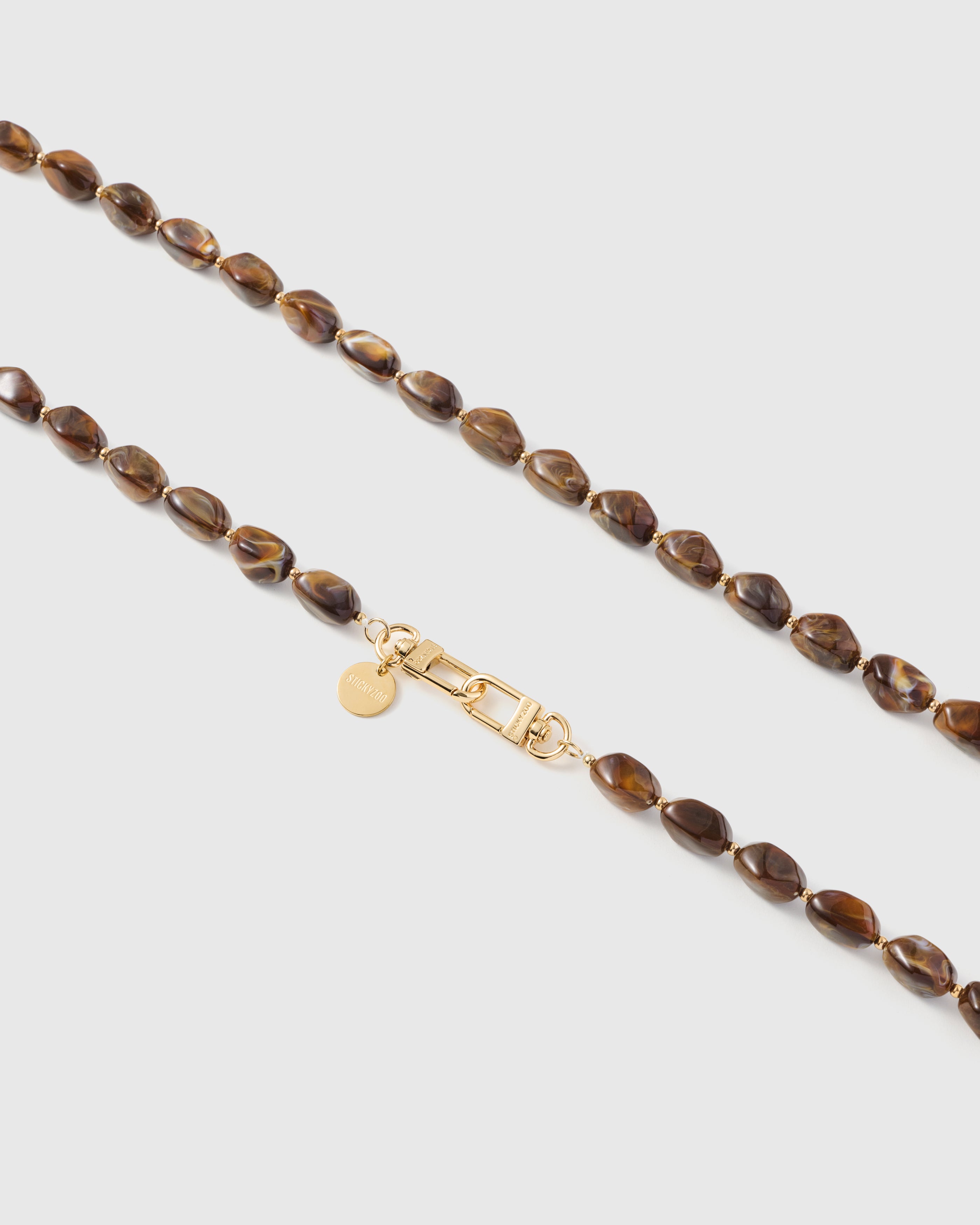 Elongated Marble Bead Phone Strap — Handmade Amber Wristlet
