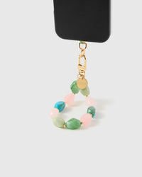Sorbet marble mix phone strap hanging from black phone case showing wrist carry functionality