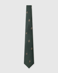 Designed in Amsterdam Forest Terrier Tie knot close-up showing embroidered terrier detail with blue collar on green silk