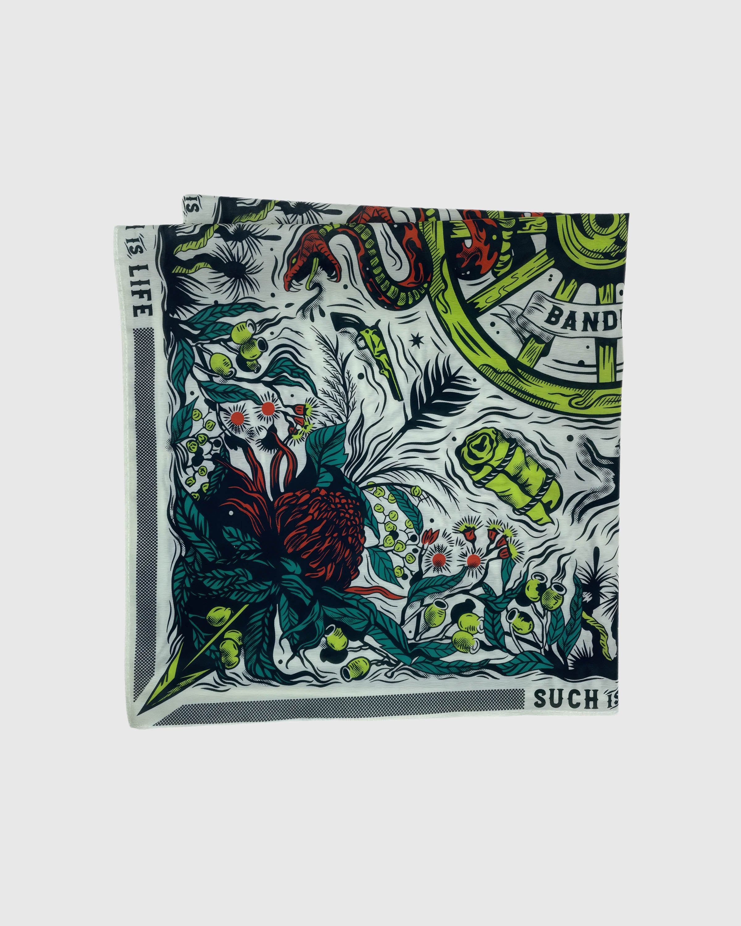Folded serpent thicket silk scarf showing the dense botanical print and the soft silk reverse