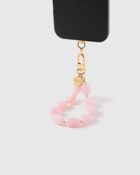 Rose agate phone strap hanging from black phone case showing soft pink stone beads