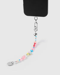 Close-up of mixed charm beads showing hearts flowers and letter blocks with silver-tone STICKYZOO clasp