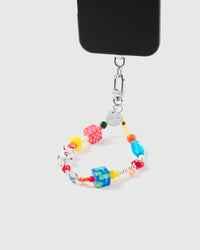 Dalmatian dice phone strap hanging from black phone case showing daily carry