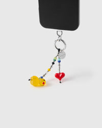 Duck and heart charm strap hanging from black phone case showing dual-strand design
