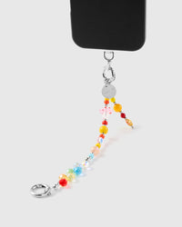Rainbow prism cluster phone strap hanging from black phone case