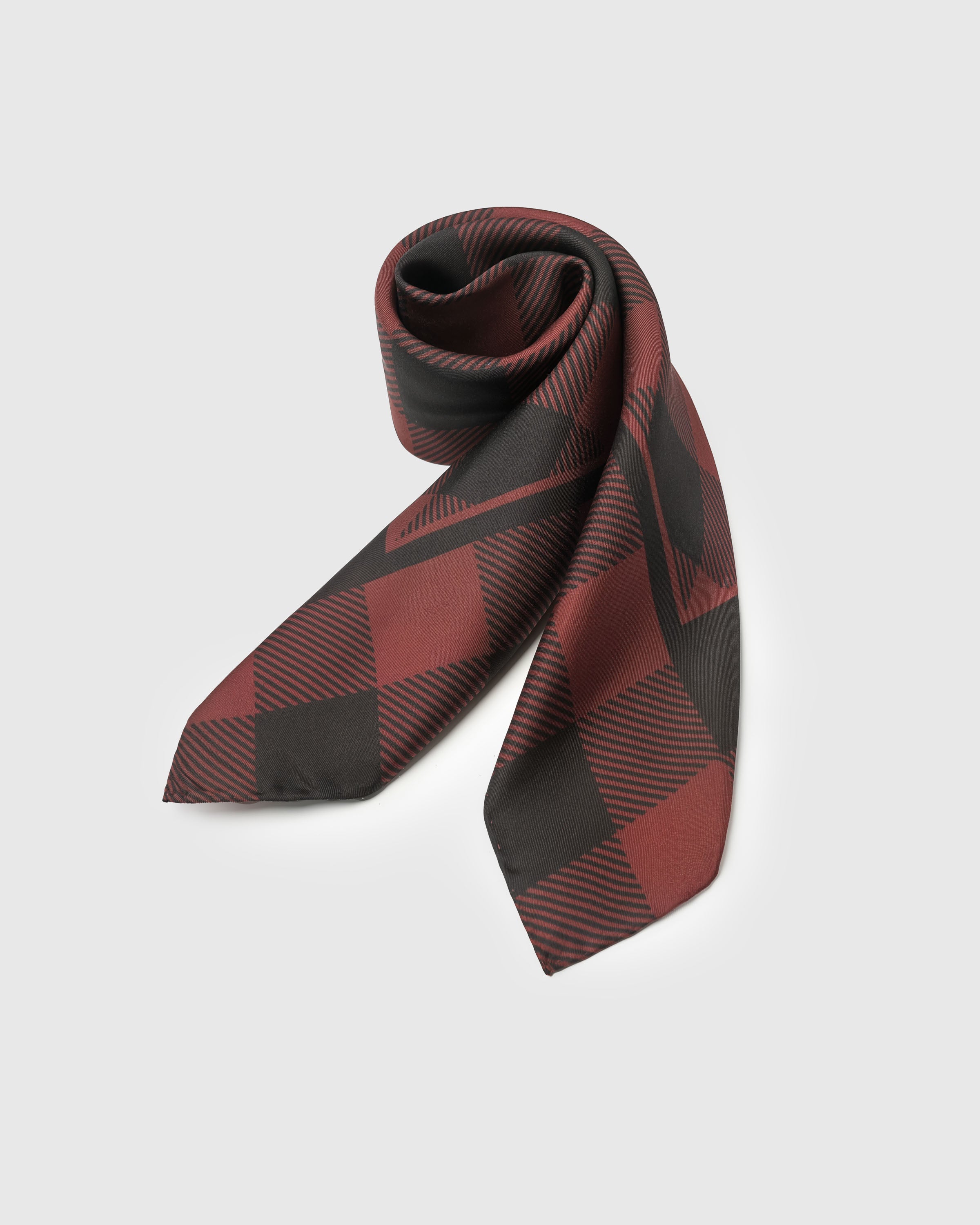 STICKYZOO buffalo check silk scarf coiled to show the soft drape and the oversized check
```