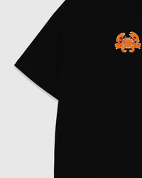 Detail of the Crab T-Shirt upper chest and dropped-shoulder seam with the beaded crab and 230gsm cool-touch cotton surface