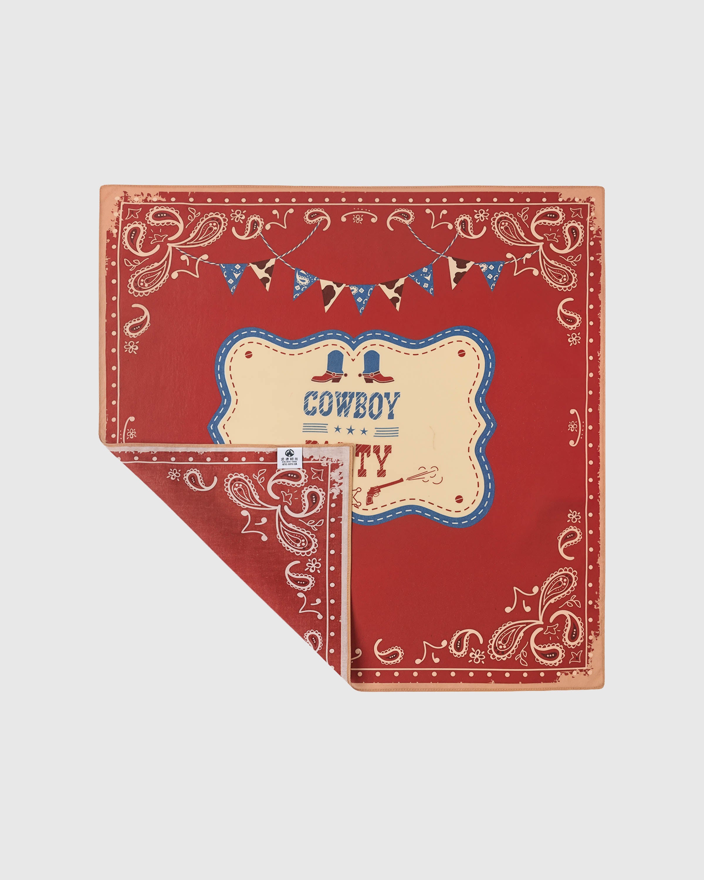 Folded rodeo paisley silk scarf showing the central placard and the soft silk reverse