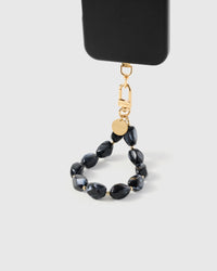 Close-up of obsidian marble stone beads showing charcoal swirls and gold-plated STICKYZOO clasp