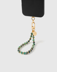 Close-up of real turquoise stone beads showing natural speckle pattern and gold spacers