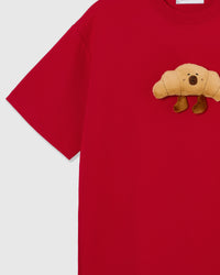 Detail of sleeve and side on STICKYZOO red Runaway Croissant T-Shirt showing boxy construction