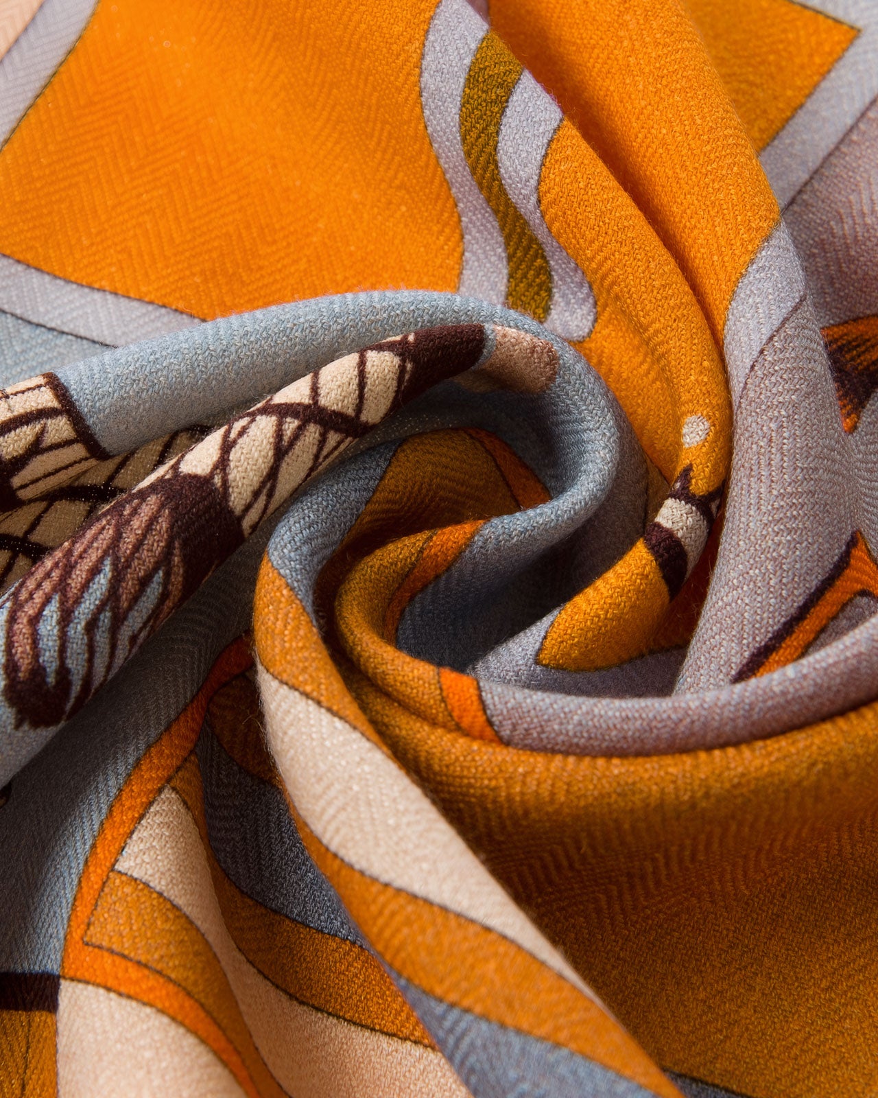 Horse blanket patchwork silk scarf with twelve saddled horses across orange, saffron, blush, and sage panels
```