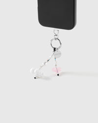 White cloud and pink jelly heart beaded strap hanging from a black phone by a silver-tone ring with engraved STICKYZOO disc.