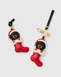Handmade Santa Dachshund Stocking leather bag charm — built to last from French Alran goatskin, holiday collectible. STICKYZOO Amsterdam design.
