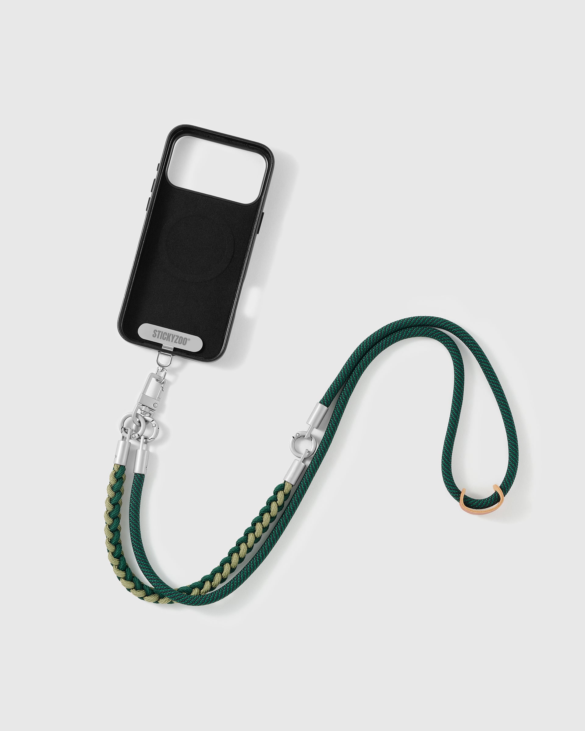 Phone worn cross-body on the pine braided strap, hands-free for everyday carry