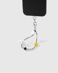 STICKYZOO Frost Cloud Smile phone strap attached to black phone case showing wrist carry